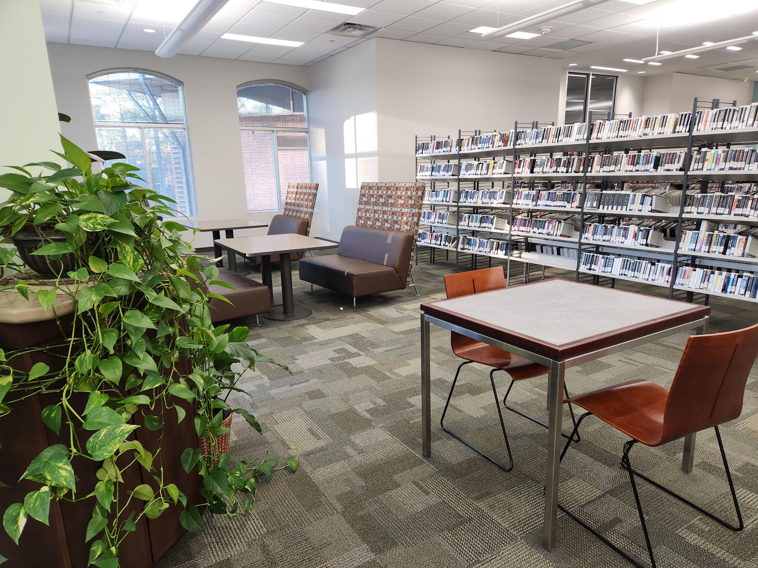 Adult non-Fiction area with tables, chairs and computers